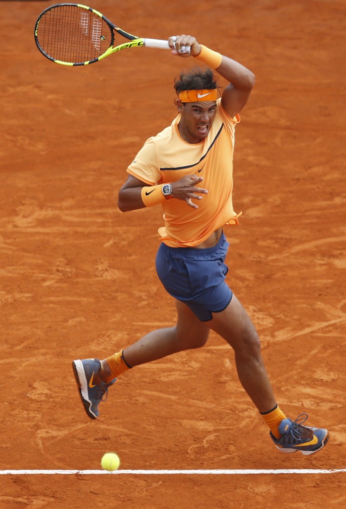 Spain's Rafael Nadal returns the ball to France's Gael Monfils during the final tennis match at the Monte-Carlo ATP Masters Series Tournament in Monaco on April 17, 2016.   AFP PHOTO / VALERY HACHE / AFP PHOTO / VALERY HACHE