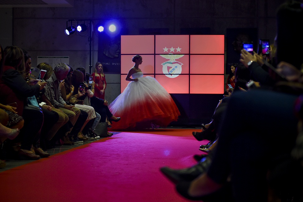 A model wears a creation by designer Micaela Oliveira during a presentation by Portuguese football club Benfica of 24 wedding dresses, 12 evening dresses and four dresses for girls at the Stadium of Light in Lisbon. Heavily indebted Portuguese giants Benfica unveiled tonight its first-ever collection of wedding dresses which it will sell alongside other club items such as jerseys, baby diapers and dog beds. / AFP PHOTO / PATRICIA DE MELO MOREIRA